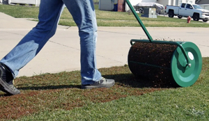 lanzie roller adding peat to lawn surface